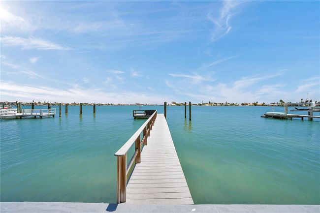 A 72-foot dock made of Trex is boat-lift ready. Deep water accommodates larger vessels, and the Gulf is just moments away. | Image 14