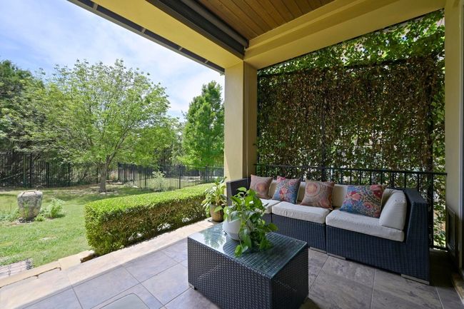 View of patio / terrace featuring an outdoor covered patio and view of trees | Image 24