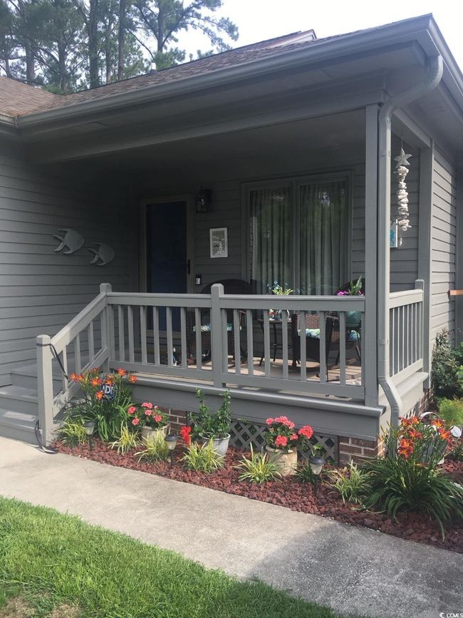 View of exterior entry with covered porch | Image 26
