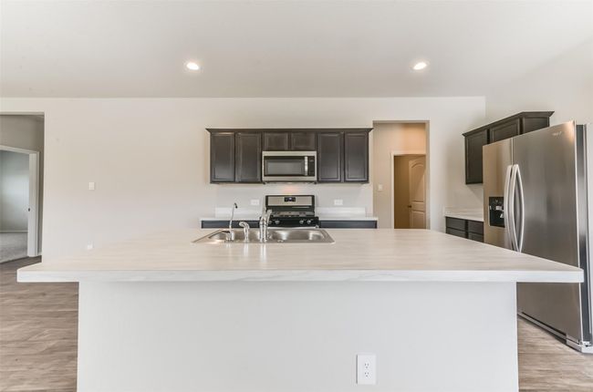 Large island with space for breakfast stools. | Image 15