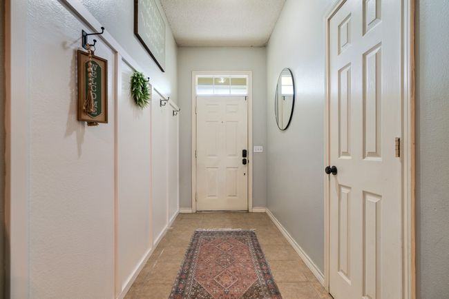 Doorway with light stone finish floors | Image 8