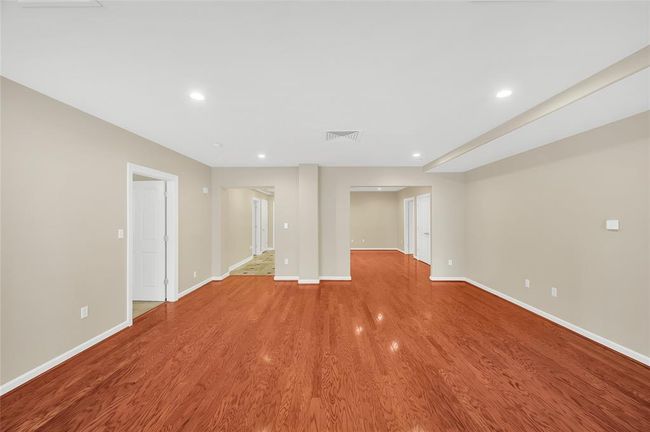 The 1519 sq/ft (per HCAD) of this one bedroom unit is larger than many two bedrooms in the building. This allows large rooms and an open feeling. In Entry Hallway in background to left you can see an open door to Half Bath and a closed door to coat closet. | Image 15