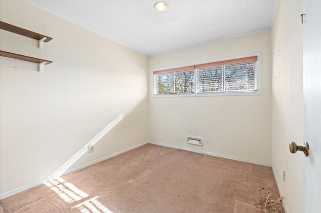Unfurnished room featuring light carpet | Image 13