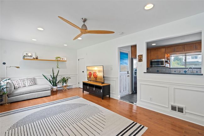 Kitchen featuring appliances with stainless steel finishes, recessed lighting, ceiling fan, brown cabinets, and crown molding | Image 12