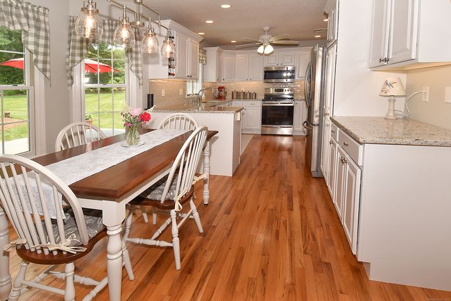 Easy entertaining in this eat-in kitchen with hardwood floors | Image 11