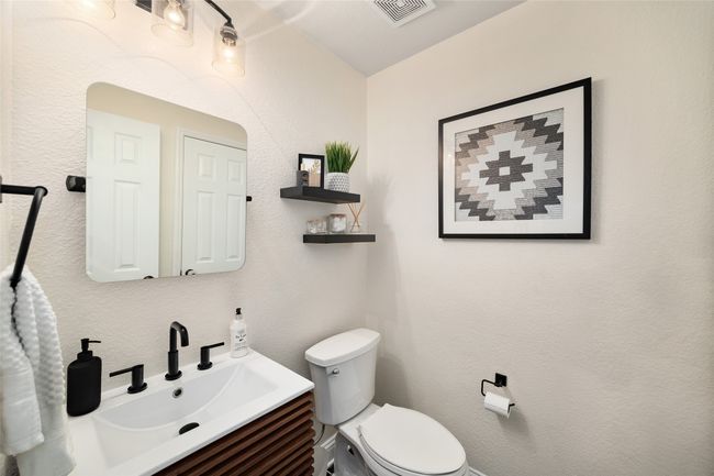 Half bath with toilet, vanity, and visible vents | Image 19