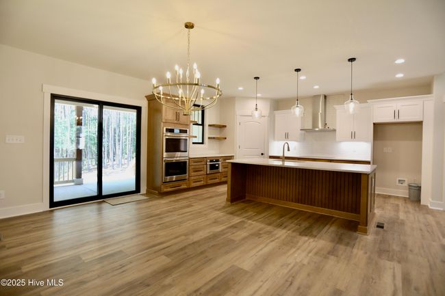 Open & bright kitchen w/direct access to covered porch | Image 10