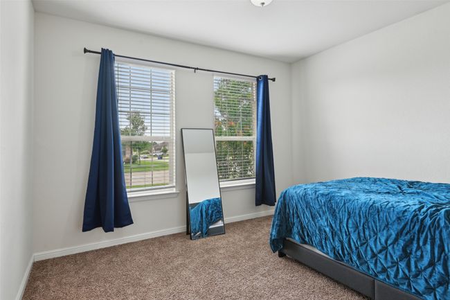 Bedroom featuring carpet flooring and baseboards | Image 18
