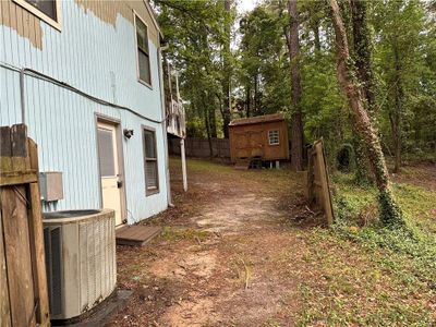 View of yard with central AC unit and a shed | Image 3