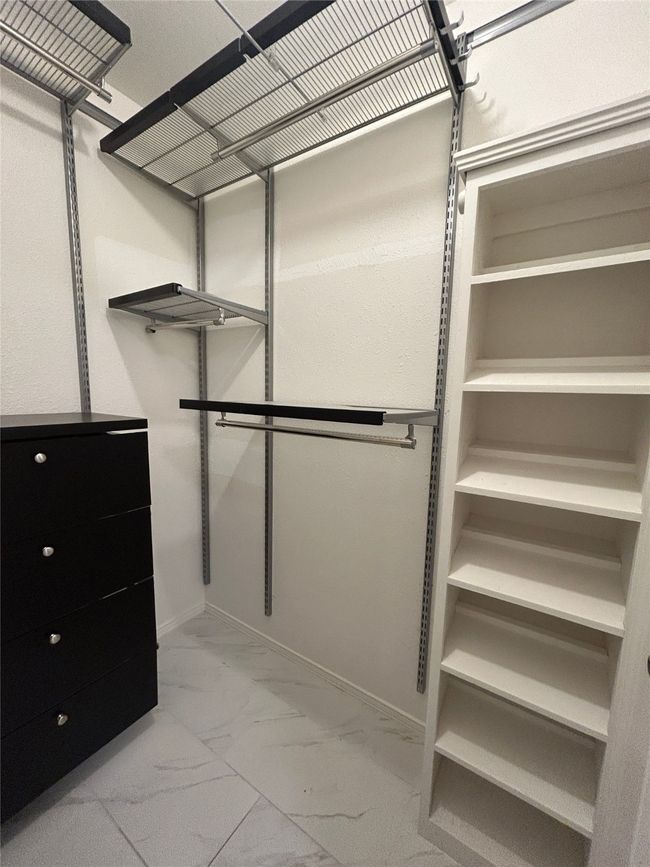 Spacious closet with light marble finish floors | Image 27