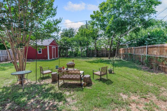 View of yard with a fire pit | Image 20