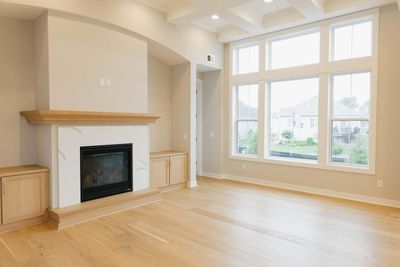 Featuring 3 bedrms (or 2 bedrooms and flex room), large 2-car garage with storage, stunning Gathering Rm w/12' coffered ceiling & wall of windows + vaulted sunroom, Gorgeous kitchen & the convenience of main level living! On a beautiful cul-de-sac! | Image 3