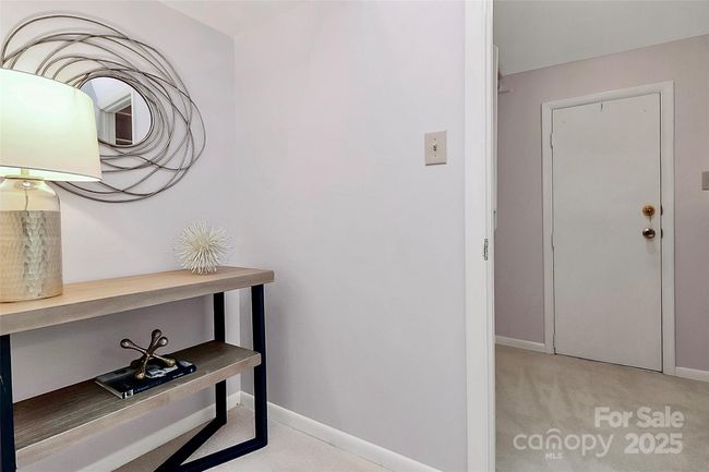 Connected to primary closet and primary bath, this versatile space can be utilized in so many ways! Add customizable shelving, more hanging space, built in options for shoes or even a dressing island. | Image 13