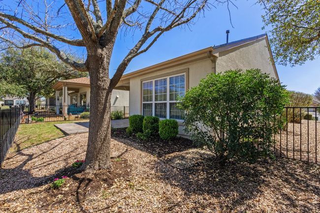 View of side of property featuring stucco siding and fence | Image 35