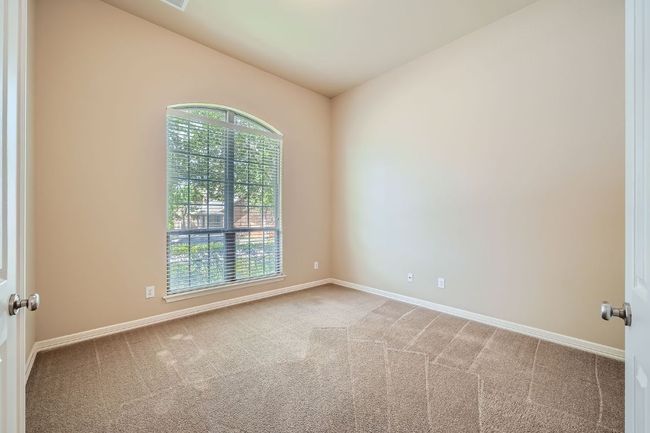 Spare room featuring carpet floors and baseboards | Image 14