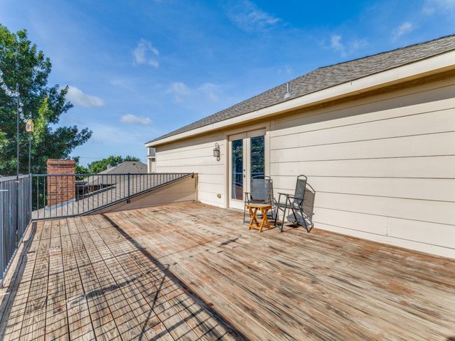 Wooden terrace featuring french doors | Image 13