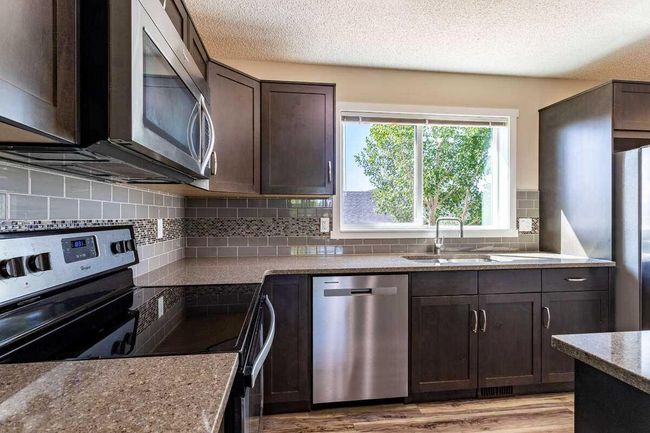 144 Sunvalley Road, Townhouse with 3 bedrooms, 4 bathrooms and 2 parking in Cochrane AB | Image 14