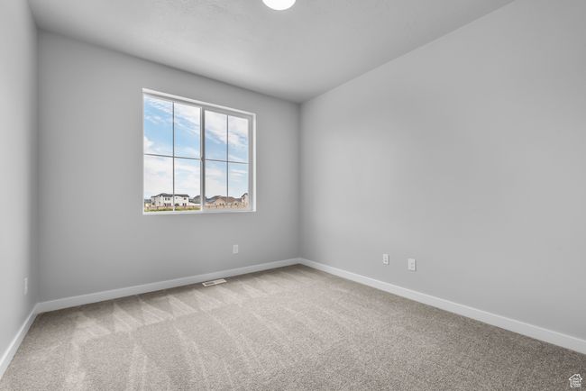 Carpeted empty room featuring baseboards | Image 7