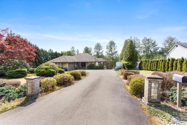 View of front of property featuring driveway and a garage | Image 4