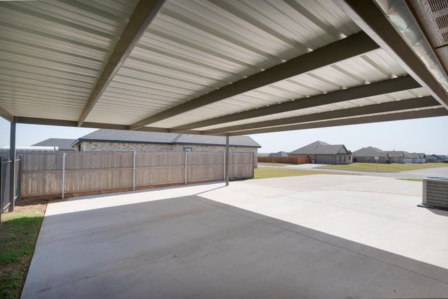 View of patio / terrace featuring central AC unit and fence | Image 37
