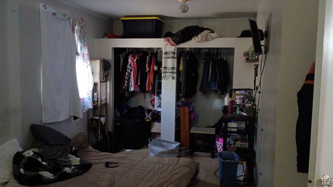 Bedroom with carpet and closet. | Image 8