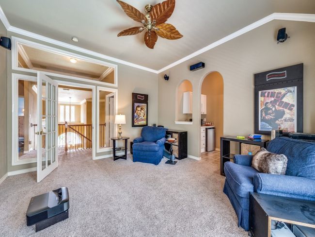 Media room featuring kitchenette with sink. | Image 22