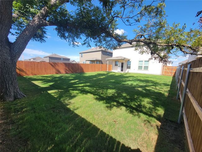 View of yard featuring a fenced backyard | Image 29