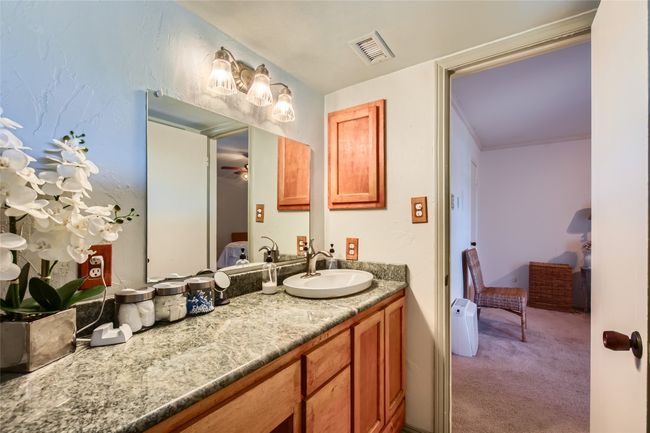 Bathroom featuring vanity, connected bathroom, and ceiling fan | Image 17