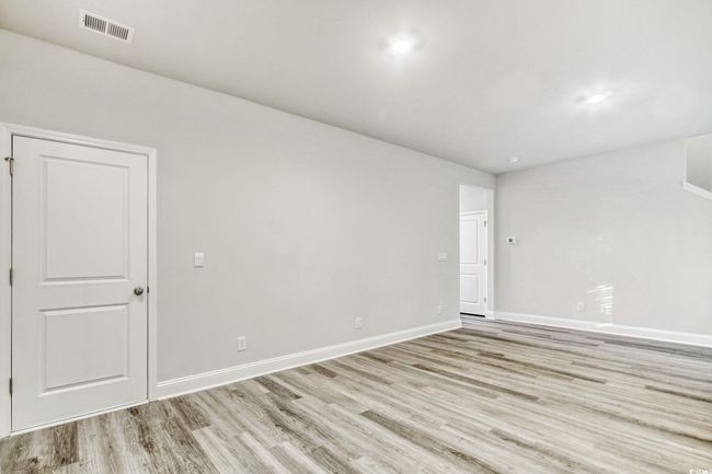 Unfurnished room featuring light wood-type flooring | Image 13