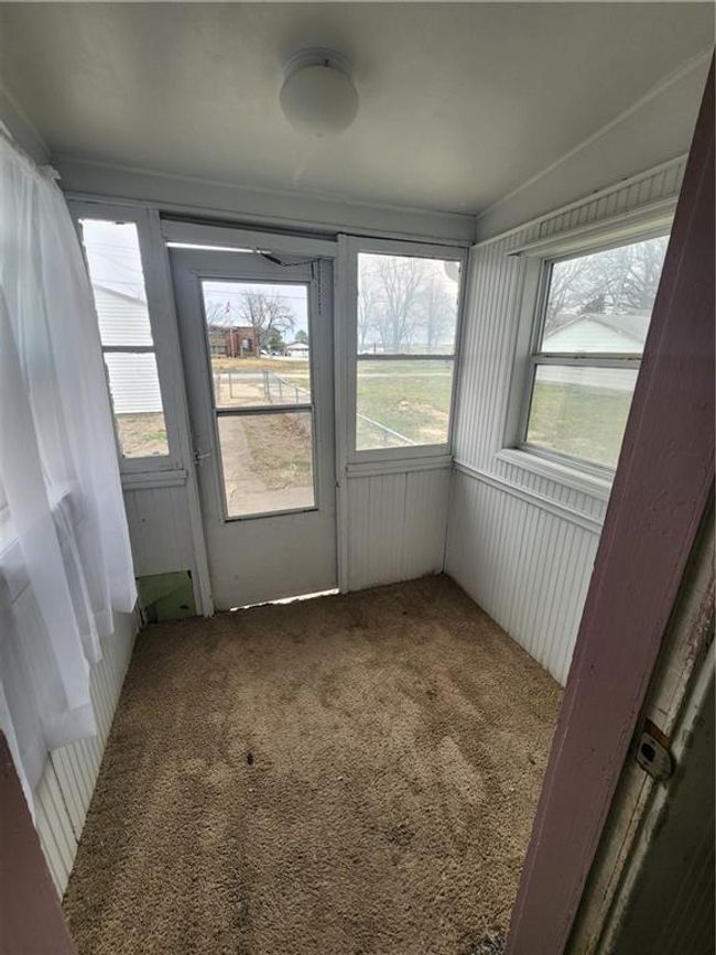 View of unfurnished sunroom | Image 25