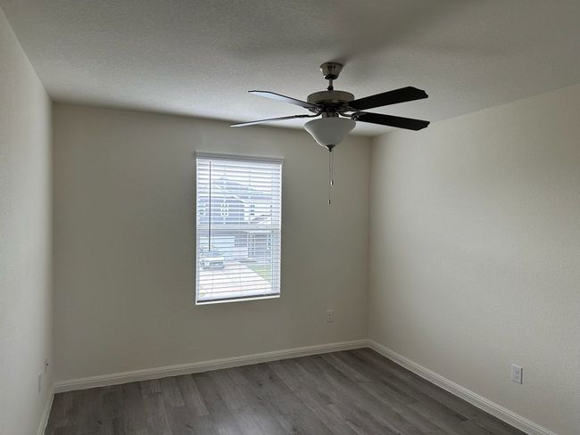 Unfurnished room with wood finished floors and ceiling fan | Image 17