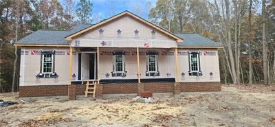 Property under construction featuring a porch | Image 1