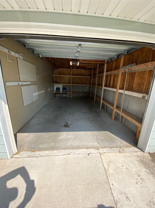 Garage with a garage door opener | Image 12