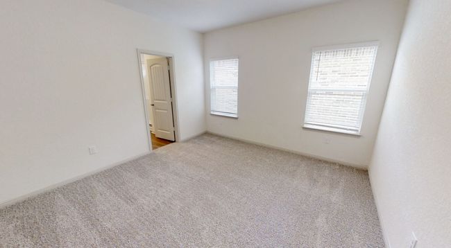 Carpeted empty room featuring baseboards | Image 9