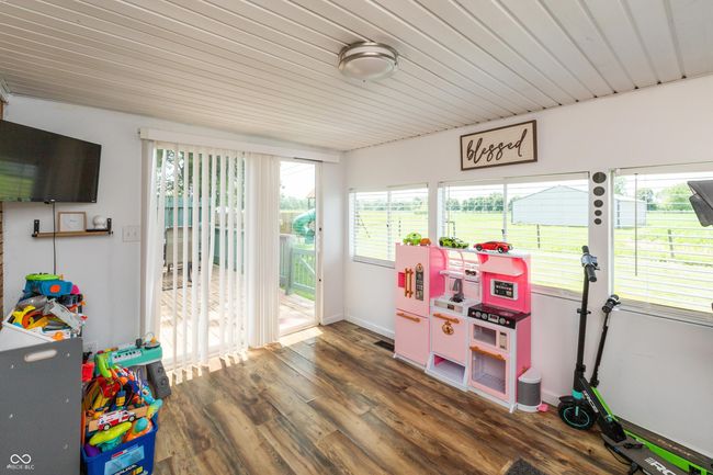 game room with wood finished floors and wood ceiling | Image 19