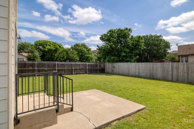 View of yard featuring a patio area and a fenced backyard | Image 29