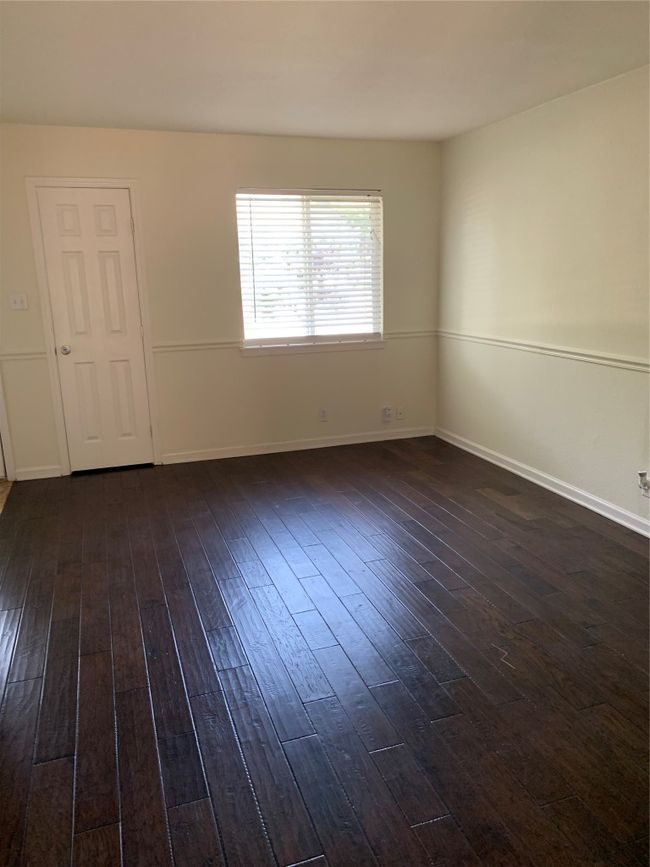 Empty room featuring dark wood-type flooring and baseboards | Image 5