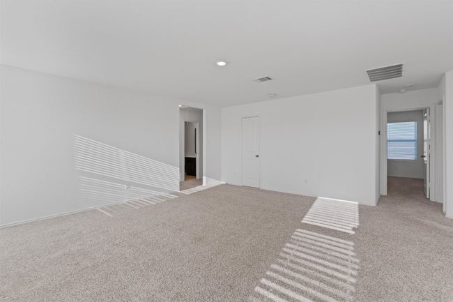 Empty room with light carpet and visible vents | Image 21
