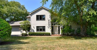 View of front of house featuring a garage and a front lawn | Image 2