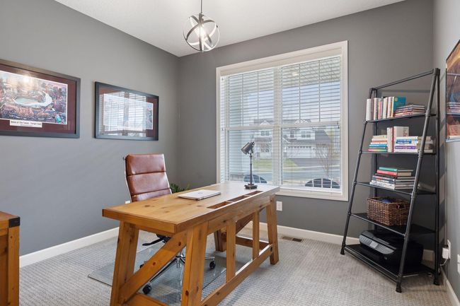 The office is found just off the foyer with views of the front yard. | Image 5