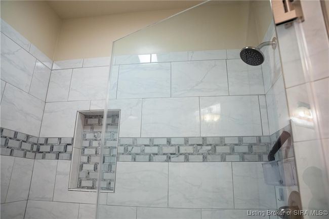 Toiletry cubby in full bathroom shower. | Image 21