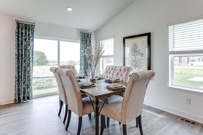 Good sized dining area for many to gather and enjoy. Photo of Model Home. Options and colors may vary. Ask Sales Agent for details. | Image 10