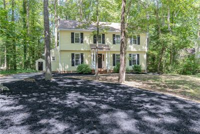 Colonial-style house featuring an outdoor structure | Image 2