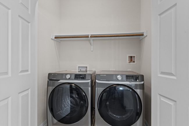 Washroom featuring washing machine and dryer | Image 25