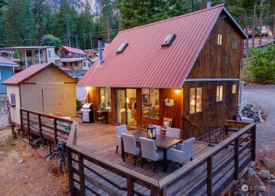 Exterior twilight view 3 of home w/ outdoor living area overlooking Lake Chelan. | Image 3