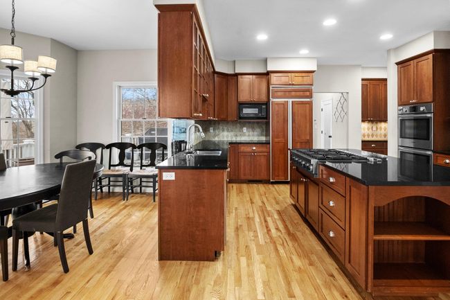 Top-of-the-line Bosch appliances and extensive prep space make this kitchen a dream for both cooking and entertaining. | Image 8