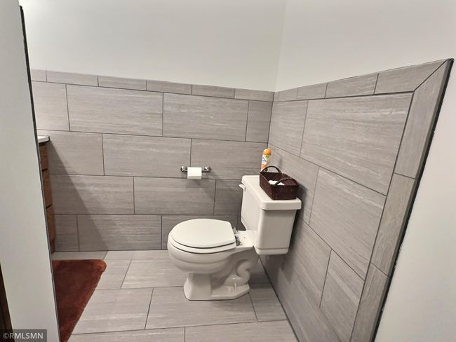 Lower-level half bath has been recently updated | Image 32
