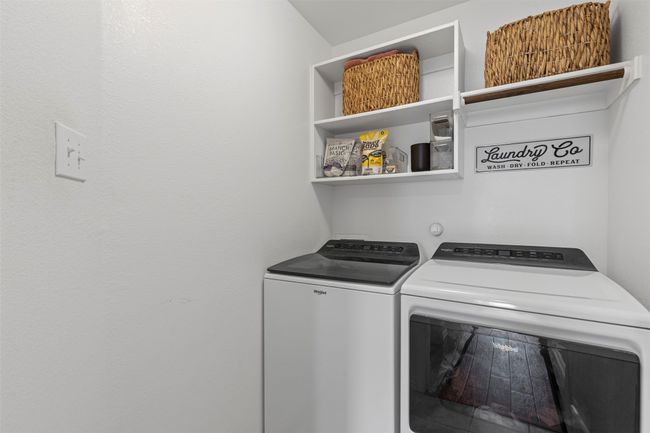 Laundry area with washer and clothes dryer | Image 13