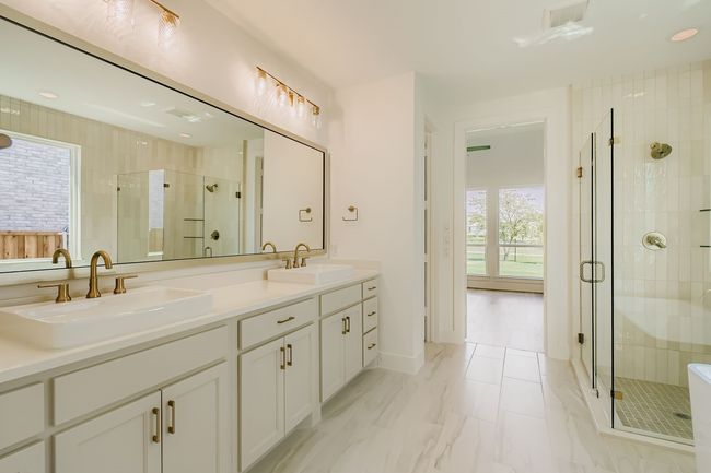 Full bath featuring a stall shower, recessed lighting, and double vanity | Image 16
