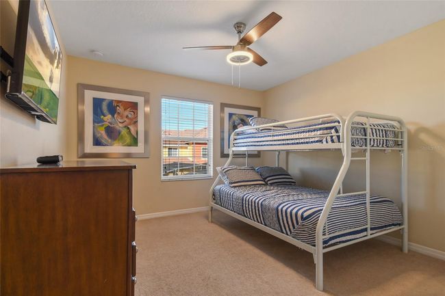 Guest Bedroom Upstairs with a bunk bed that is a queen bed on the bottom, with a single bed on top on the lower | Image 16